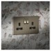 Knightsbridge 13A 2 Gang Screwless Flat Plate Double Pole Switched Socket - Antique Brass/Black