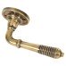 From The Anvil Aged Brass Reeded Door Handles on Round Rose