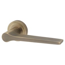 Jedo Antique Brass Fire Rated Door Handles on Round Rose - Geo Range 
