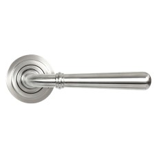 From The Anvil Satin Stainless Steel Door Handles on Round Art Deco Rose - Newbury Range 