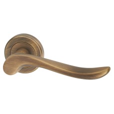Serozzetta by Carlisle Brass Antique Brass Scroll Door Handles on Round Rose - Verdun Range 