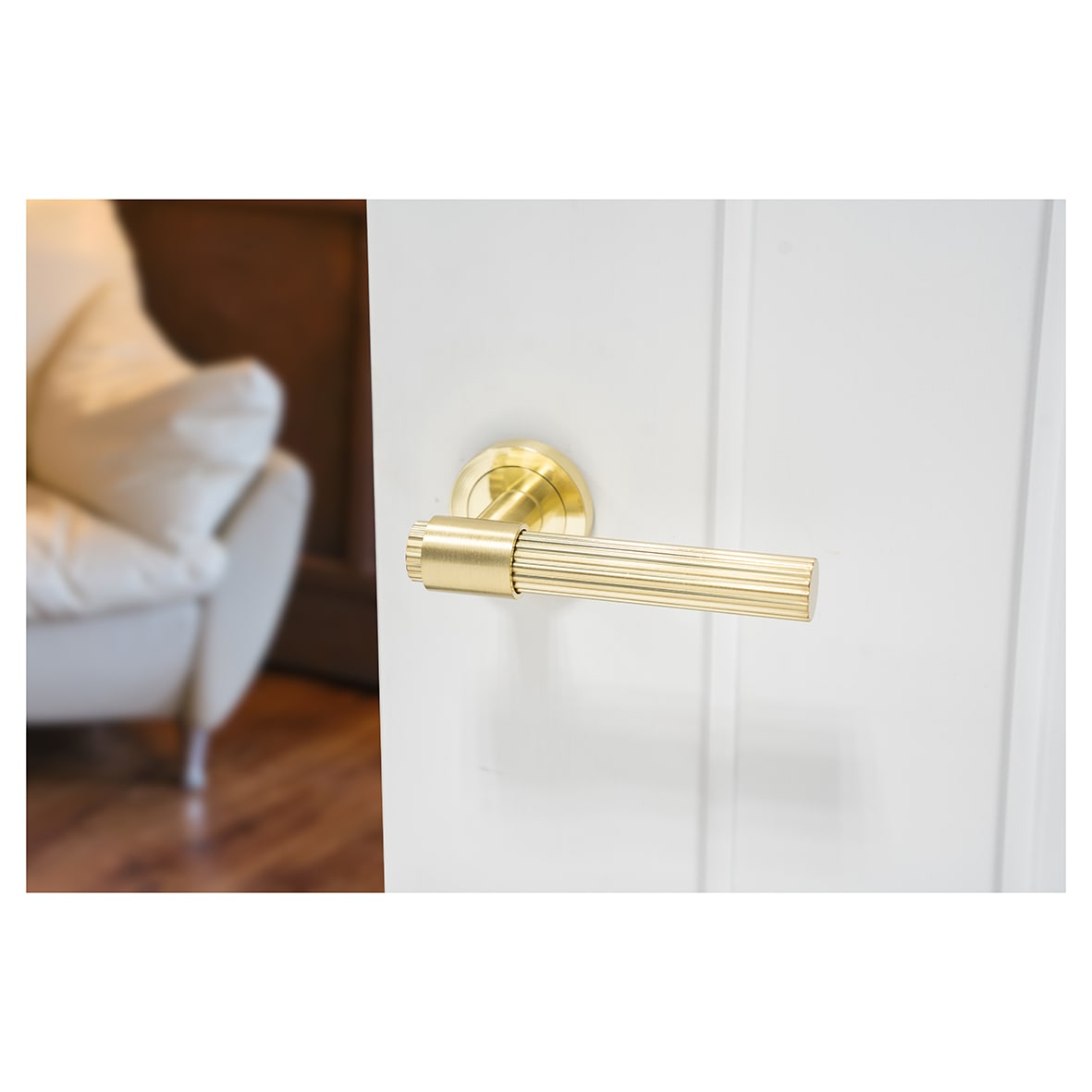 Satin Brass Lines Door Handles on Round Rose - Eva Range - view 4