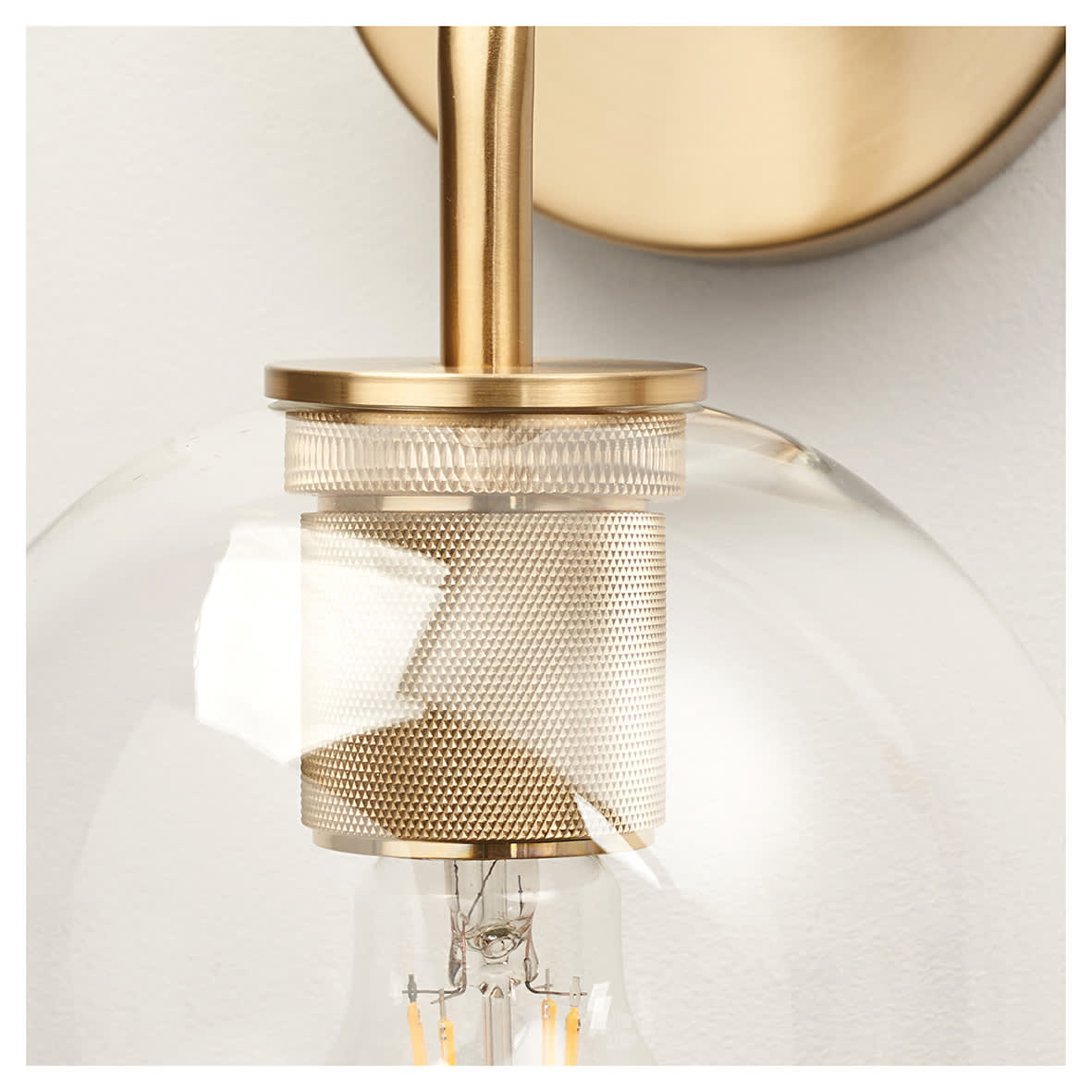 Noord Knurled Indoor Wall Light - Satin Brass Fittings and Domed Clear Glass Shade - view 4