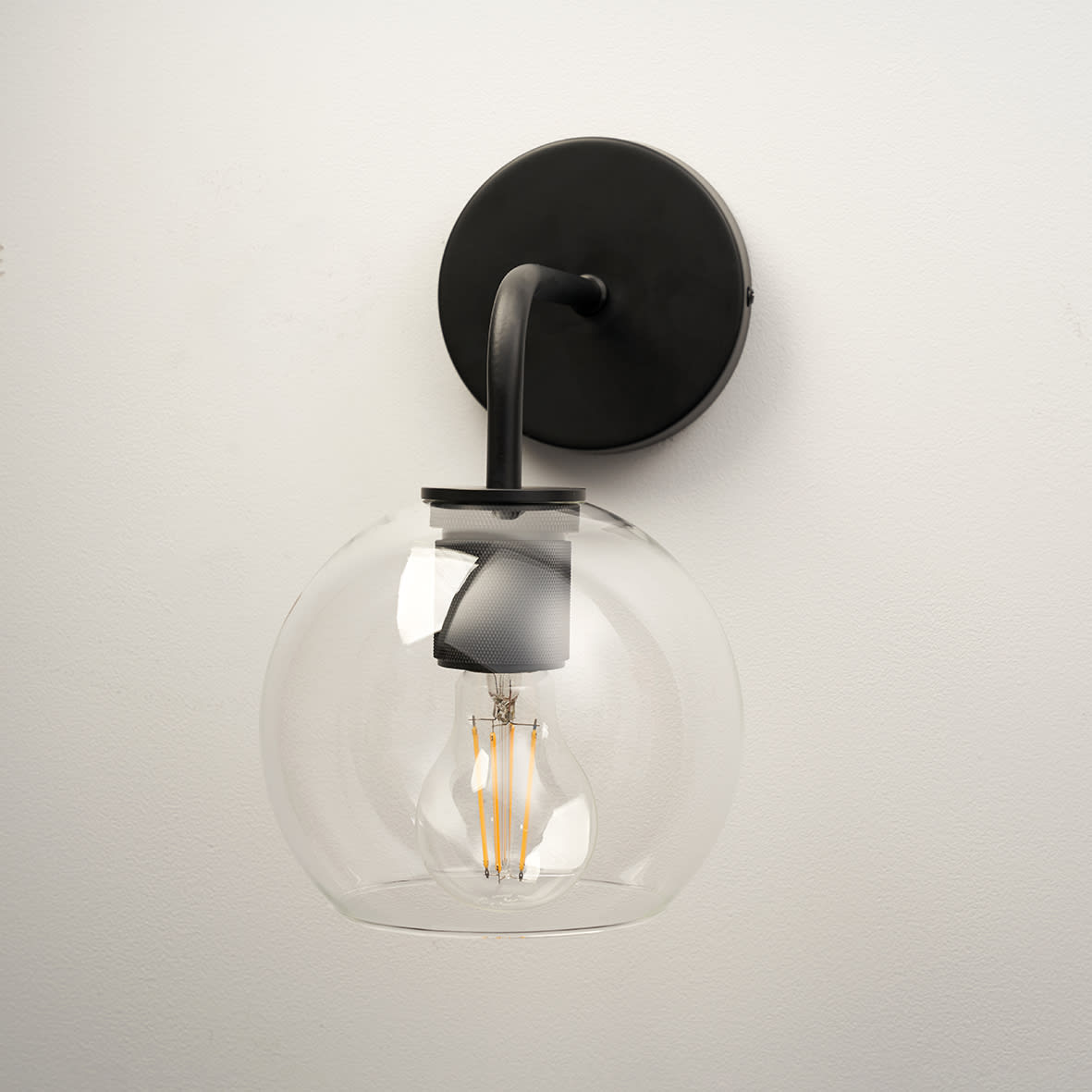 Noord Knurled Indoor Wall Light - Matt Black Fittings and Domed Clear Glass Shade