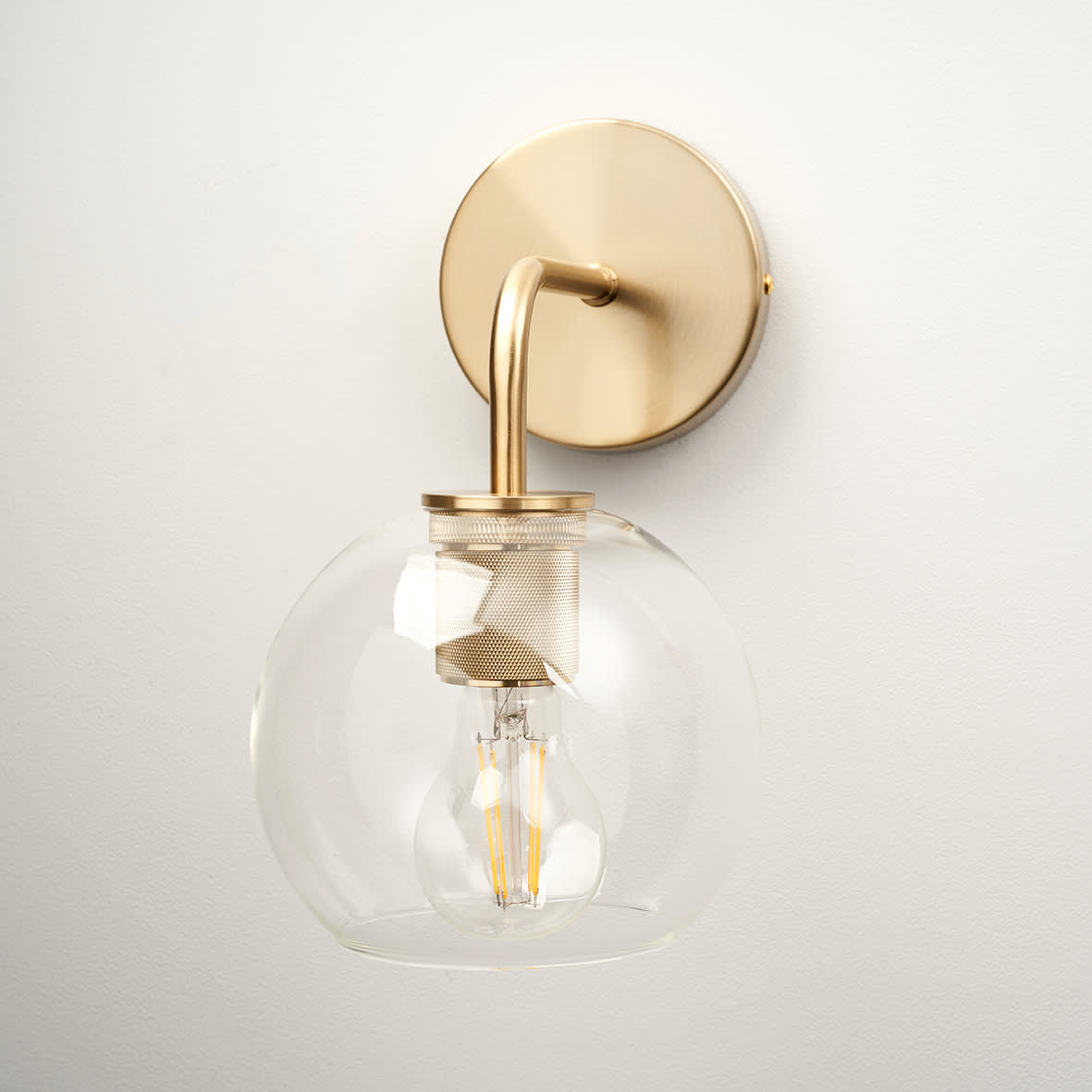 Noord Knurled Indoor Wall Light - Satin Brass Fittings and Domed Clear Glass Shade