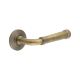 Antique Brass Fire Rated Door Handles on Round Chamfered Rose - Highgate Range